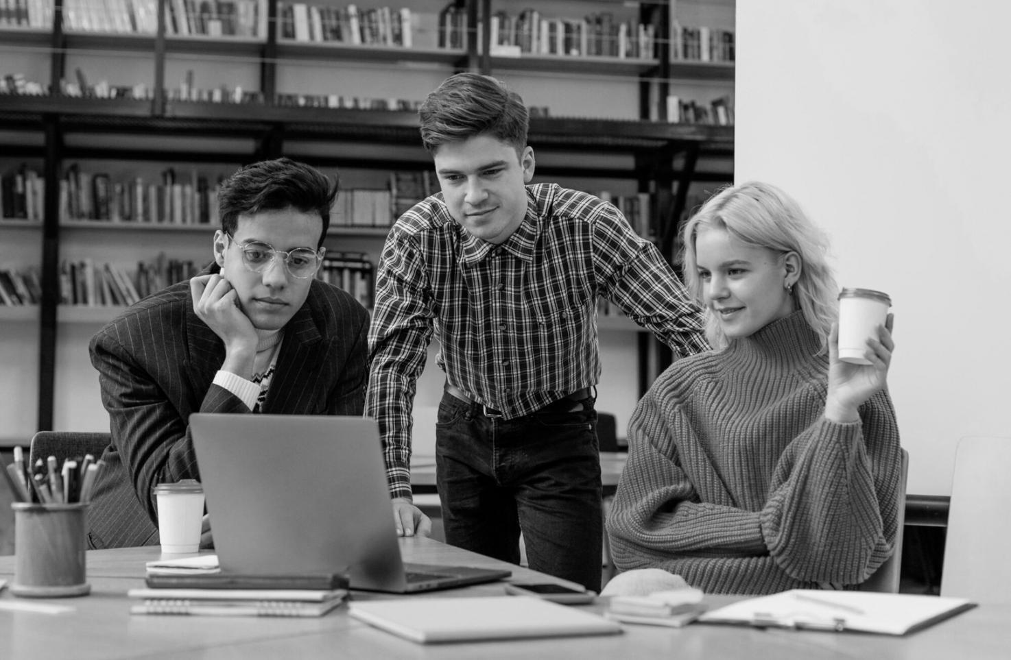 Group of diverse students engaged in financial analysis workshop discussion