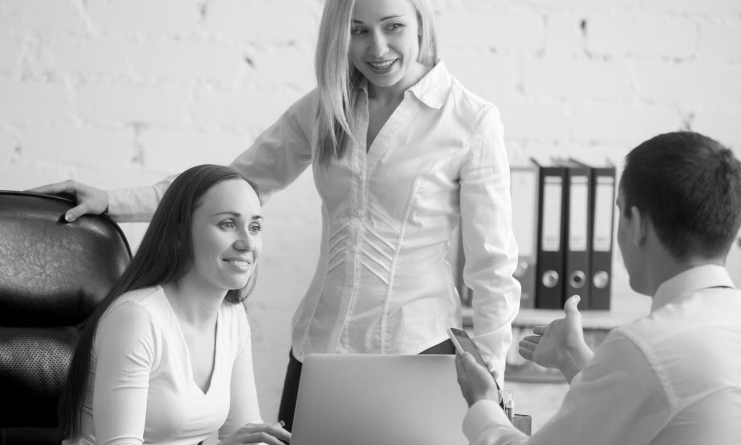 Modern classroom setup with presentation screen showing financial charts and data visualization
